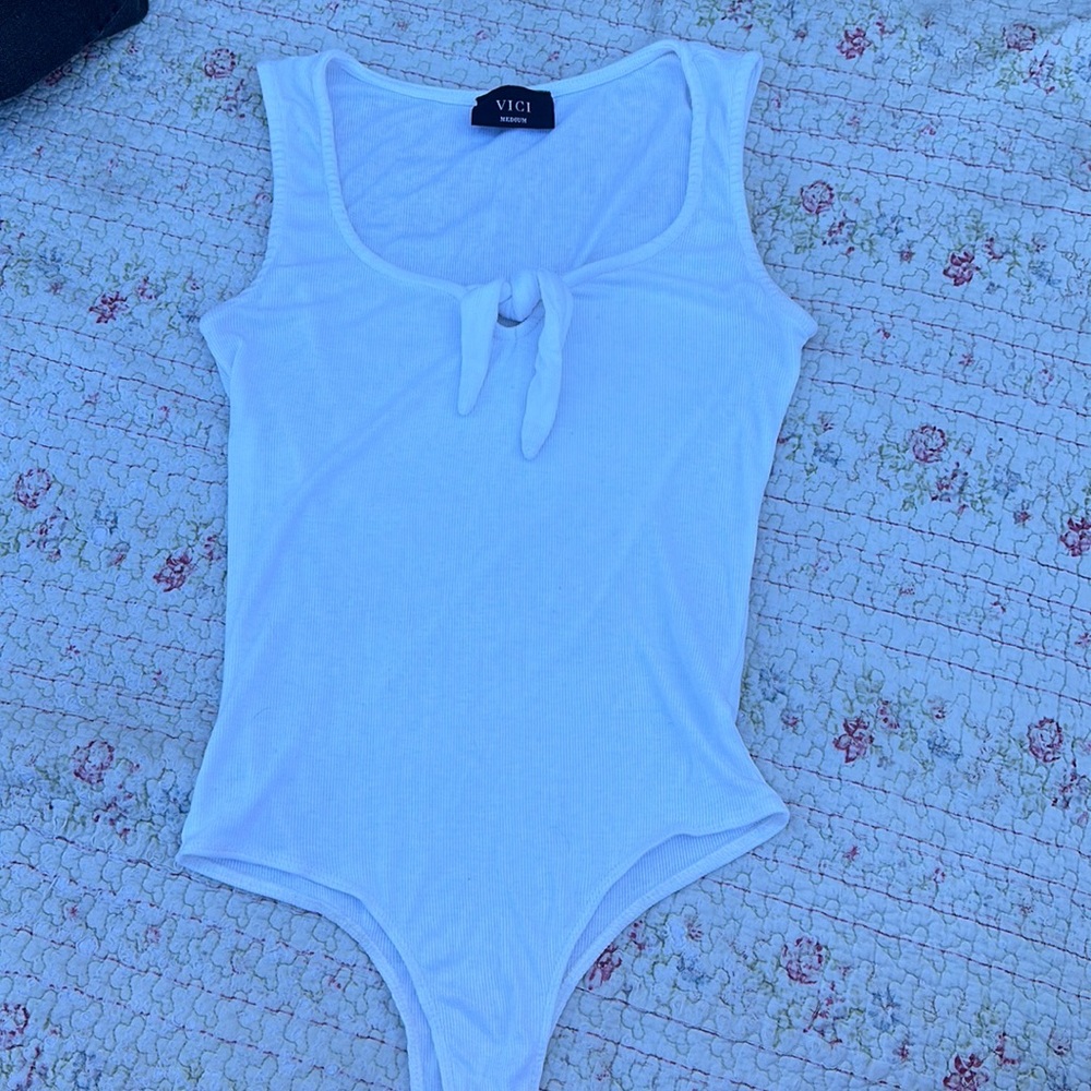 white body suit with tie